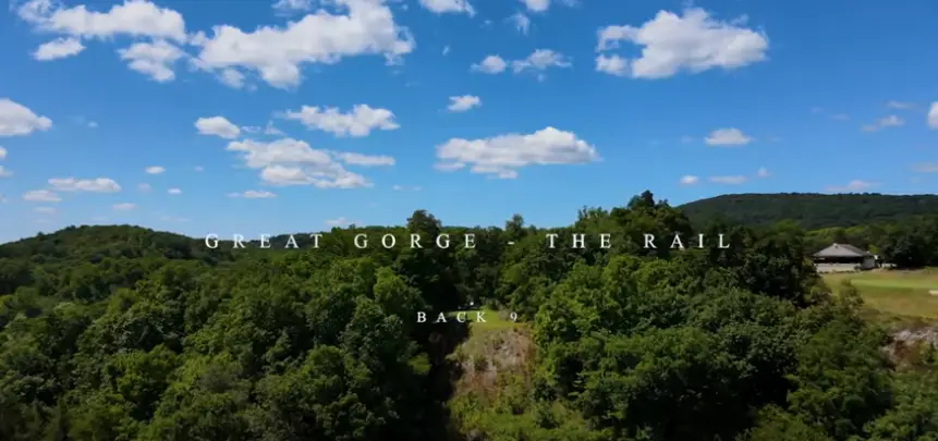 A screenshot from a YouTube video showcasing the Great Gorge golf course, highlighting its expansive green fairways, natural surroundings, and picturesque landscape.