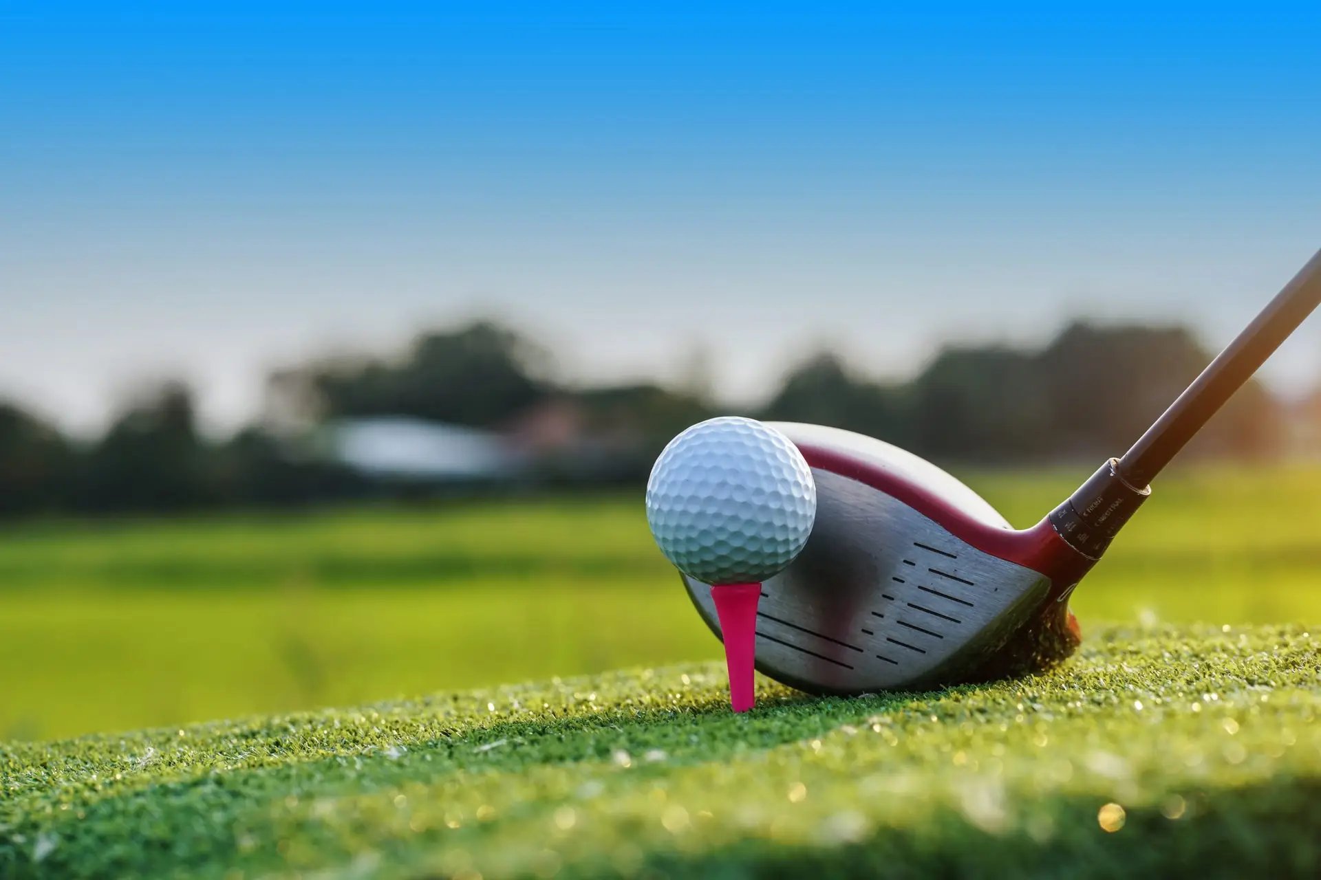 Close-up of a golf ball next to a small cross on green grass at the Great Gorge Golf Club in Vernon, NJ.