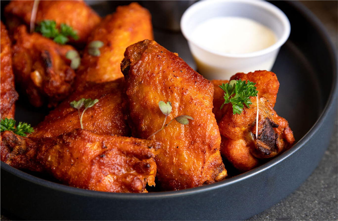 Close-up of a delicious dish served at Hef's Hut in The Great Gorge, Vernon, NJ, highlighting the dining experience that complements the indoor golf simulator.