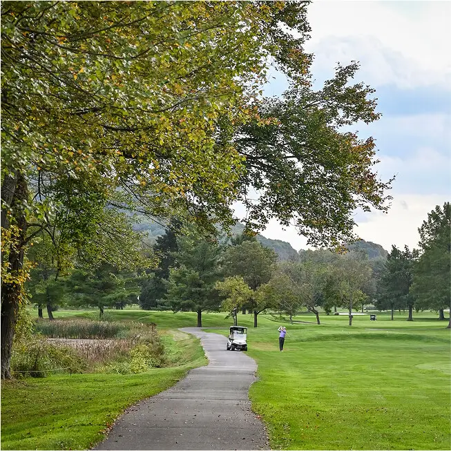Scenic path winding through The Great Gorge in Vernon, NJ, surrounded by lush greenery and offering views of the golf courses and natural landscape.