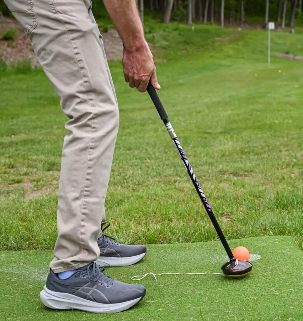 close up of man preparing to hit the golf ball at Great Gorge club