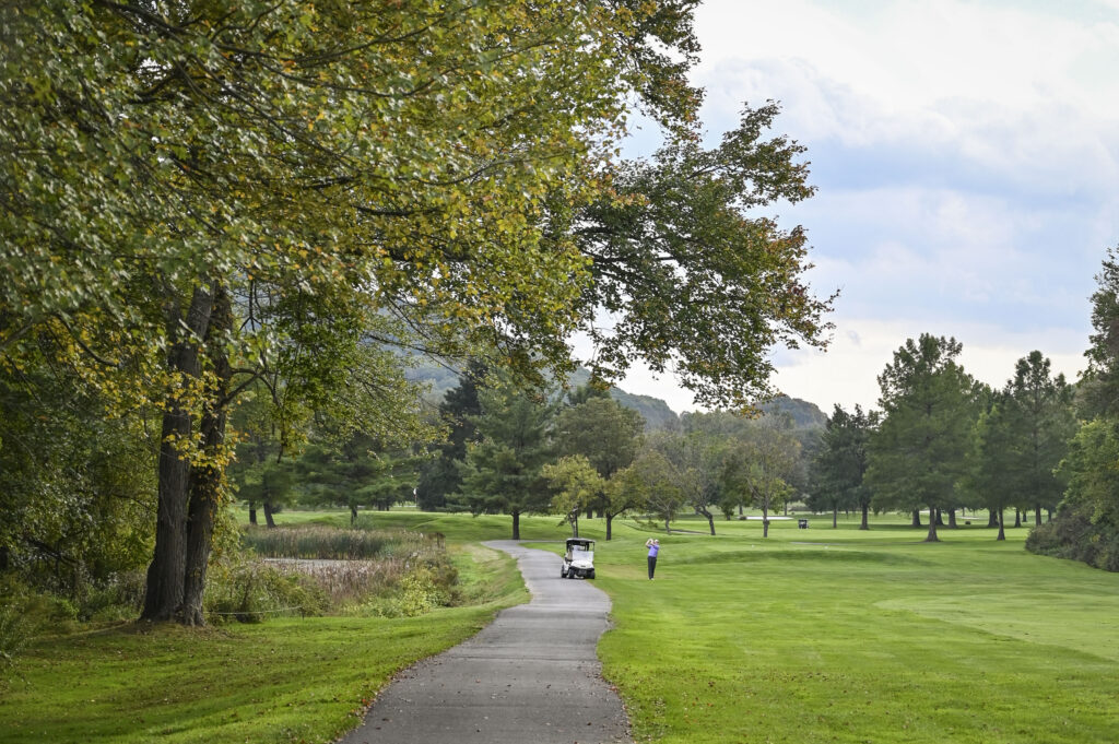 Wide view of Great Gorge Golf Club’s course and natural landscape with colorful fall trees and mountain backdrop.