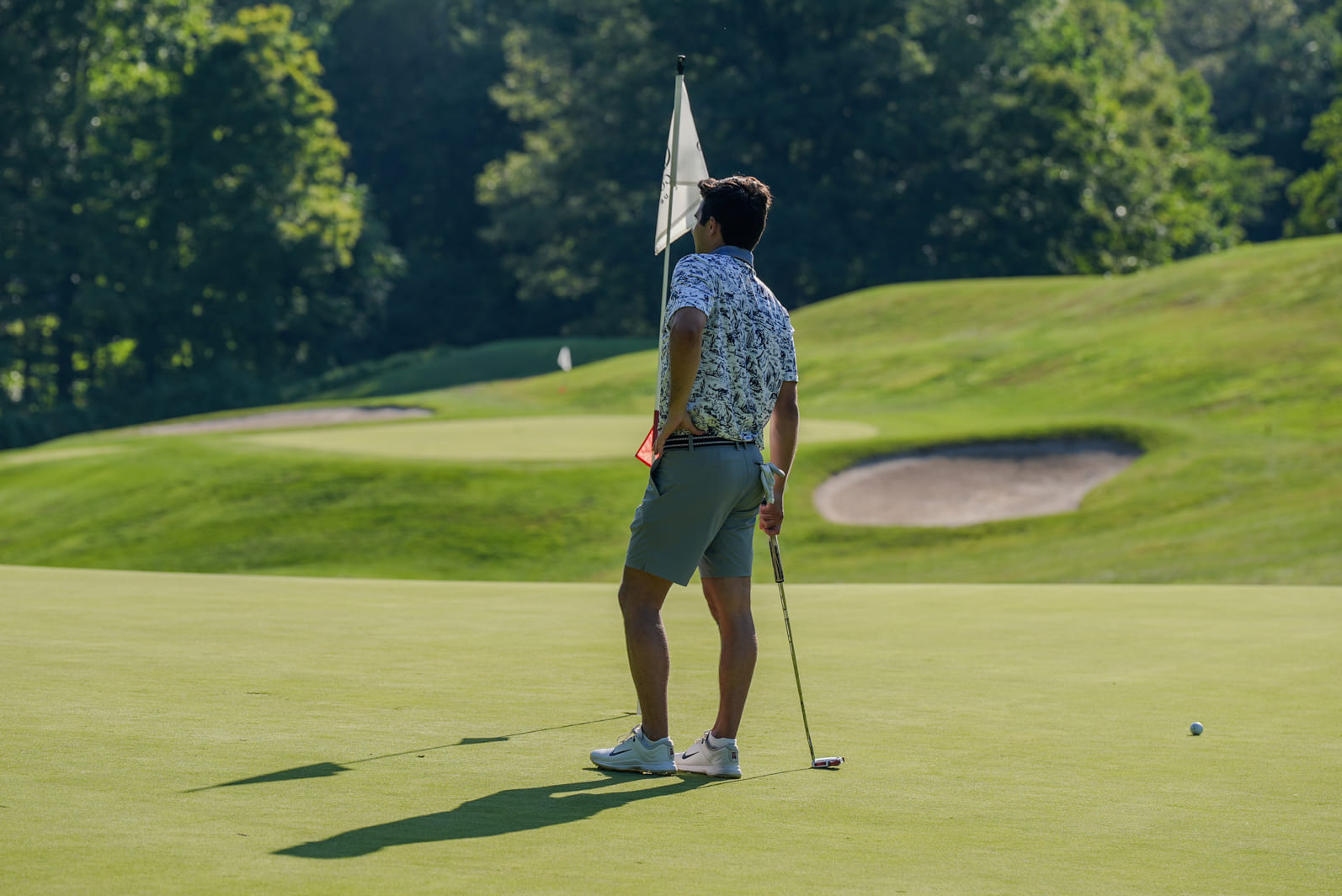 A golfer at Great Gorge Golf Club looking into the distance as he plans his next shot.